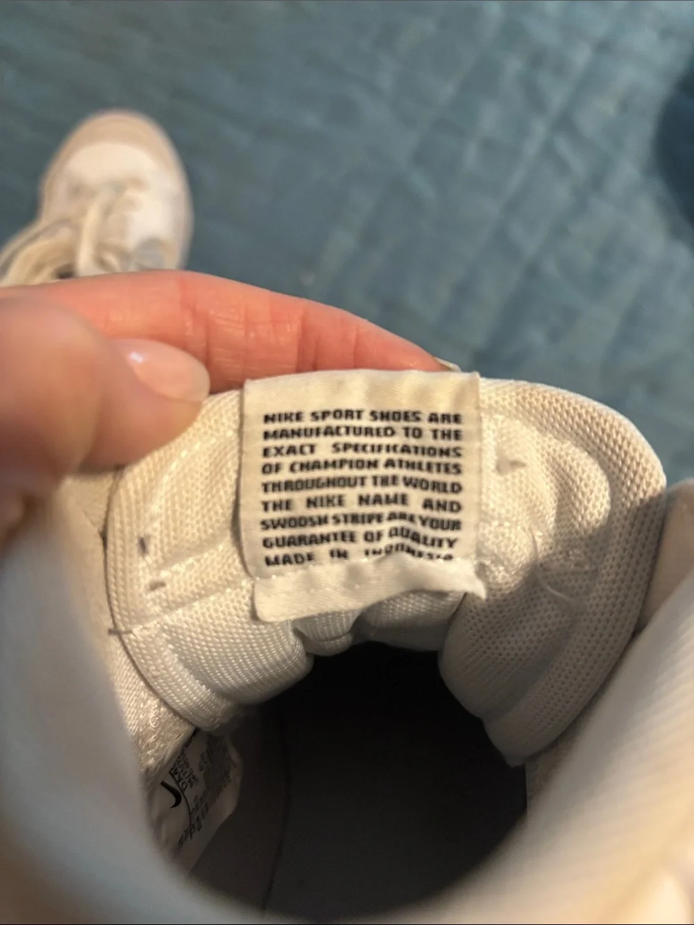 Nike White High-Top Sneakers with Black Swoosh